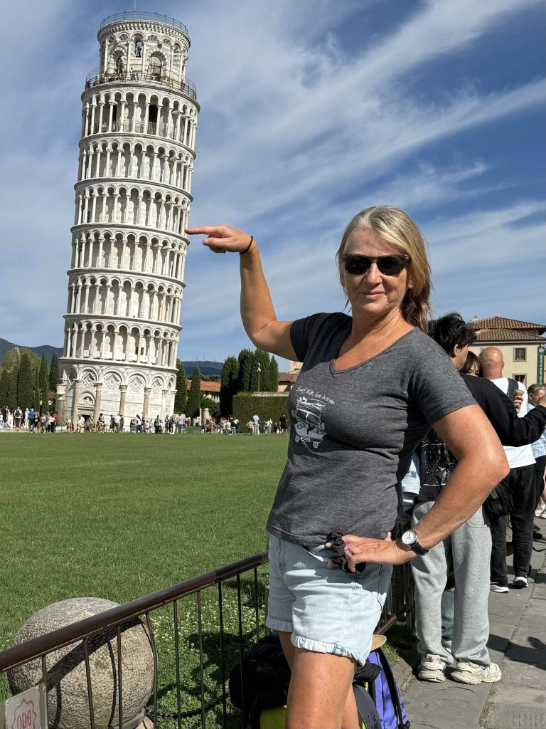 Leaning Tower of Pisa being held up by Mary in Pisa Italy