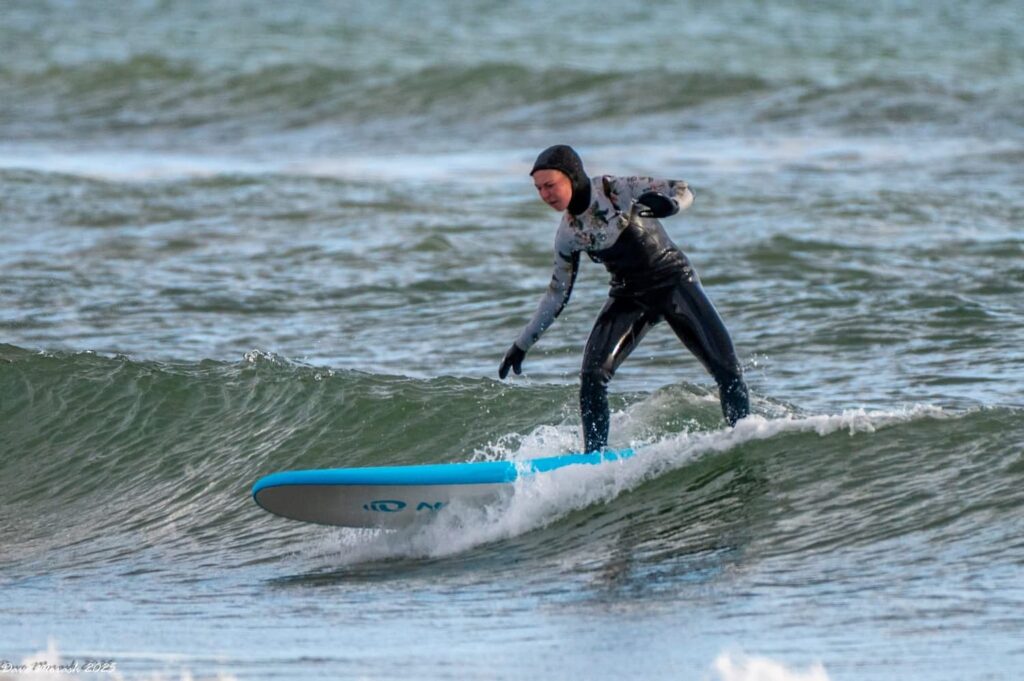 Breana surfing Lawrencetown Beach