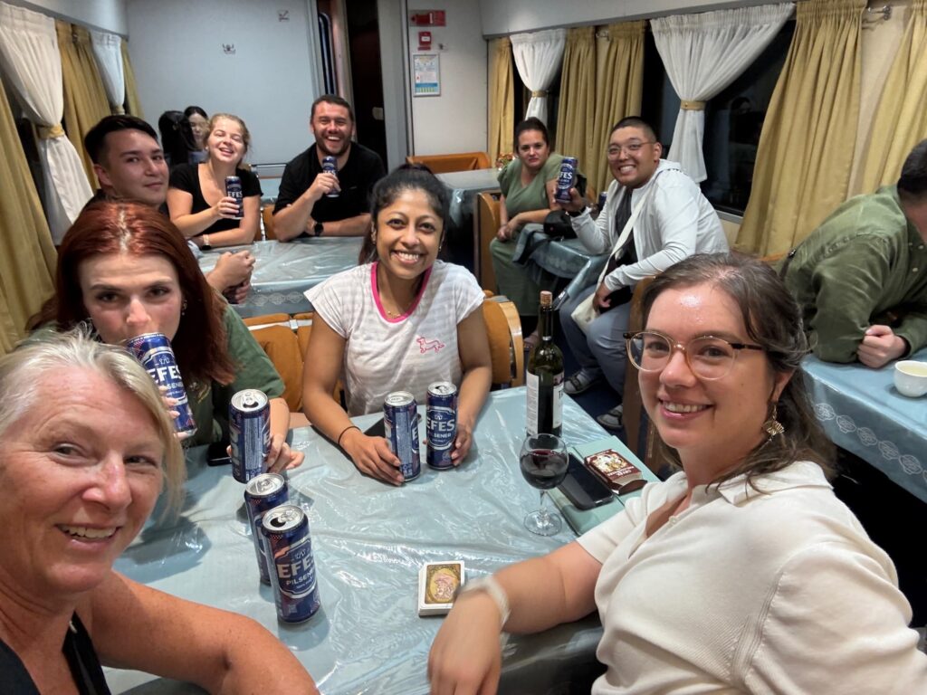 Intrepid group on night train, dining car